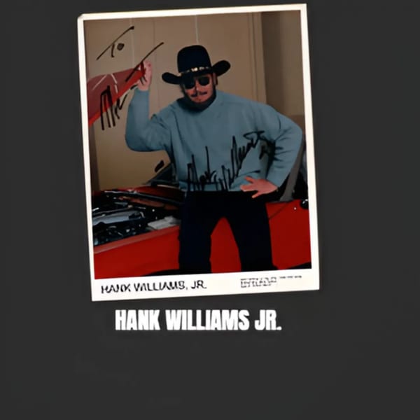 A framed photo of Hank Williams Jr. in a cowboy hat and sunglasses, leaning on a red car.